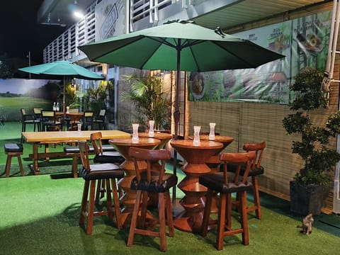 Outdoor seating at Daitoku Ramen, patio umbrella, Angeles City