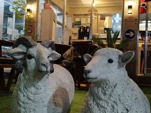 Daitoku Ramen storefront, sheep statues, on Friendship Highway in Angeles City