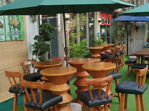 Outdoor seating at Daitoku Ramen, patio bar stools, Angeles City