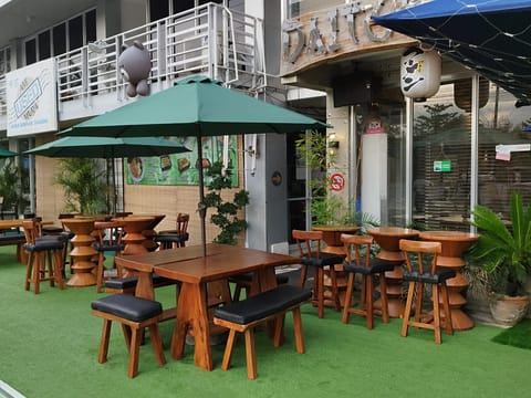 Outdoor seating at Daitoku Ramen, patio daytime, Angeles City